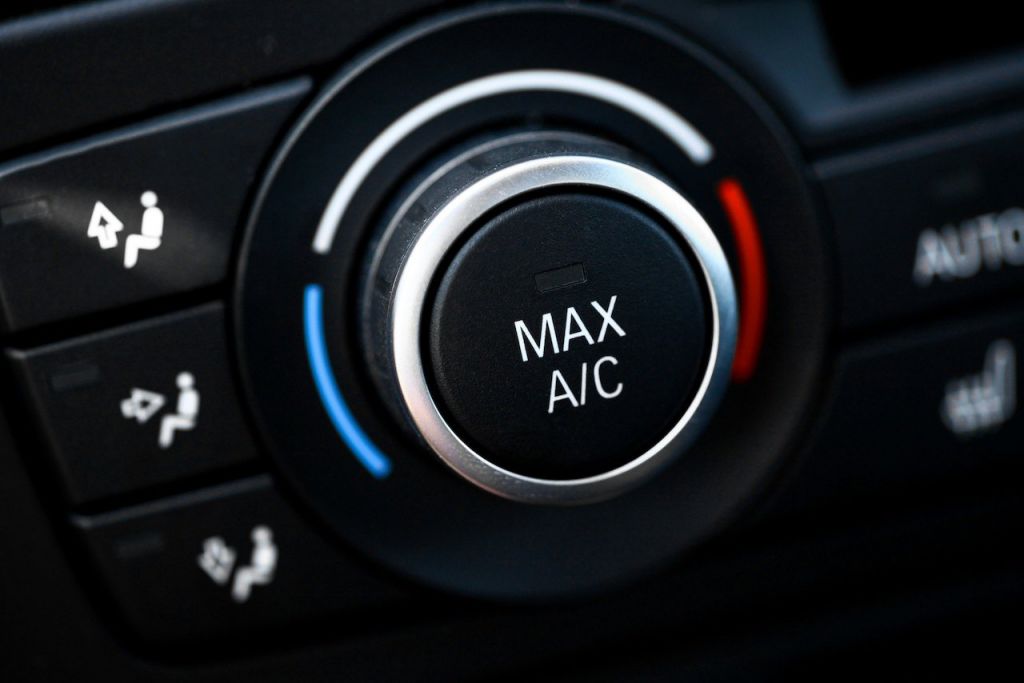 Color detail with the air conditioning button inside a car