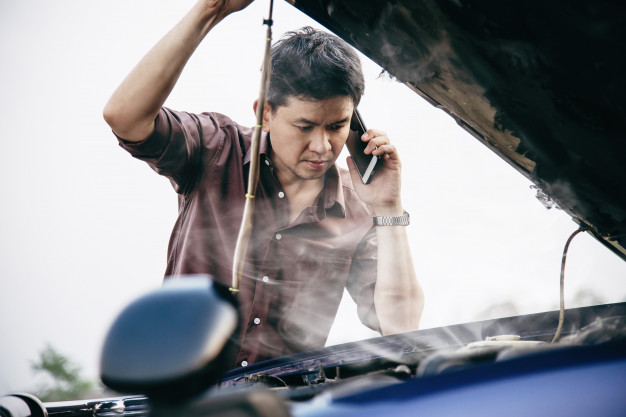 man-try-fix-car-engine-problem-local-road_1150-10663